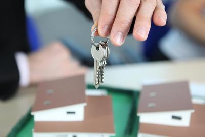 Photo of someone holding a set of freshly cut keys. They used our key cutting Gloucester service.